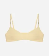 Top de bikini bandeau color amarillo claro, confeccionado en microfibra texturada con tirantes finos regulables adornados con cuentas y caracolas.