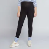 Calza larga de punto liso color negro, con cintura alta para mayor comodidad durante el embarazo.