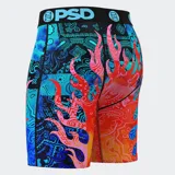 Calzoncillos bóxer estampados con diseño de llamas y bandanas en tonos rojo, naranja, azul y celeste. Cintura elástica negra con logo de la marca en celeste.