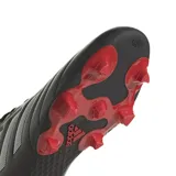 Championes de fútbol Adidas Goletto VIII, color negro con las icónicas tres tiras blancas en los laterales y suela con tapones rojos.