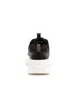 Sneakers de mujer Caterpillar modelo Intruder Lite Vent, de color negro con suela chunky blanca de EVA. Combinan paneles de malla transpirable y material sintético, con cordones negros y tiradores en la lengüeta y el talón.