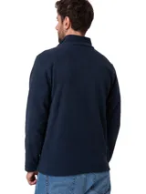 Campera polar de microfleece color azul marino, con cierre frontal completo, cuello alto con protector de mentón y bolsillos laterales. Presenta el logo de la marca bordado en un parche en el pecho.