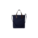 Bolso tote bag azul marino de lona con asas de mano y detalles en cuero marrón. Cuenta con un gran estampado central del icónico Polo Bear vestido de jugador de polo con casco rojo, acompañado del texto bordado "POLO BEAR by RALPH LAUREN".