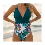 Malla enteriza bicolor de diseño combinado, con parte superior lisa en color negro de escote en V pronunciado con bordes ondulados, y parte inferior con estampado botánico de hojas verdes y flores rosadas sobre fondo negro. Cuenta con tirantes finos regulables.