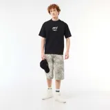 Camiseta negra de cuello redondo y manga corta, con bordado frontal en contraste con la inscripción "NXT-K ORIGINAL STREETWEAR APPAREL".