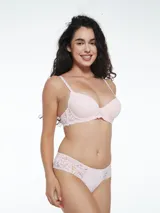 Colaless de lycra color verde claro con detalle de encaje floral en los bordes.