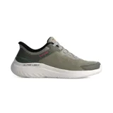 Championes deportivos Skechers modelo Bounder 2.0 Torvan, de diseño slip-in con cordones elásticos fijos. Presentan una parte superior de malla técnica en tono verde oliva, con entresuela blanca de amortiguación ultraligera y talón reforzado.