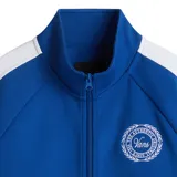 Campera deportiva azul con cierre frontal, cuello alto y mangas largas con franjas blancas. Tiene bolsillos laterales con cierre y logo de Vans bordado en el pecho.