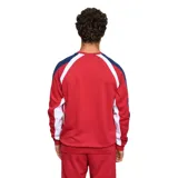 Buzo deportivo de cuello redondo marca Umbro, perteneciente al Club Nacional de Football. Presenta un diseño en tonos azul claro y azul oscuro con detalles en blanco, incluyendo el logo de la marca y el escudo del club bordados en el pecho.