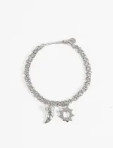 Pulsera plateada de doble cadena con dijes colgantes de acero quirúrgico hipoalergénico, con forma de cuerno y sol.
