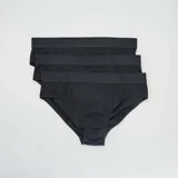 Pack de tres slips negros lisos con cintura elástica.