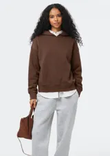 Sudadera con capucha de felpa, de corte holgado y diseño minimalista, con puños y ruedo acanalados.