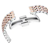 Reloj Swarovski Certa de acero inoxidable con baño en tono oro rosa y plateado. Cuenta con caja redonda, bisel con cristales en pavé, esfera guilloché blanca con índices de cristales y brazalete metálico de siete eslabones bicolor.