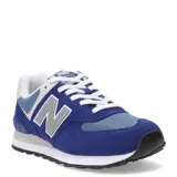 Championes urbanos New Balance modelo 574, confeccionados en una combinación de gamuza y malla en tonos azul y celeste. Presentan el logo 'N' característico en los laterales, cordones blancos y entresuela con tecnología ENCAP para mayor soporte y amortiguación.