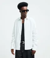 Camisa de manga larga con diseño de rayas verticales, cuello clásico y cierre frontal con botones. Confeccionada en una mezcla de algodón, poliamida y elastano, presenta una estampa gráfica en la espalda con la frase Echoes of a Restless Beat.