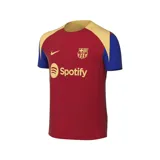 Camiseta de fútbol Nike Dri-FIT del FC Barcelona, modelo Strike. Diseño en color borgoña con mangas cortas en azul y detalles en dorado. Incluye logo de Nike, escudo del club y sponsor Spotify en el frente.