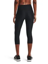 Calza deportiva tipo capri de Under Armour, color negro, con cintura alta antideslizante y bolsillo lateral. Confeccionada en tejido HeatGear ultraligero que absorbe el sudor y permite libertad de movimiento.
