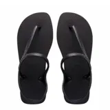 Sandalias tipo ojota Havaianas modelo Flash Urban, color negro, con diseño de tiras cruzadas que incluyen una correa trasera para mayor sujeción.