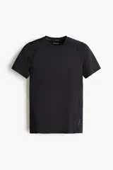 Remera deportiva de compresión H&M Move, color negro, con cuello redondo, mangas raglán y costuras planas antifricción. Confeccionada en tejido funcional DryMove que absorbe el sudor.