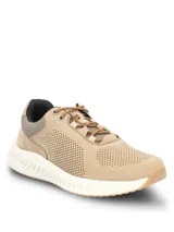 Championes de cuero color beige con perforaciones decorativas en la capellada, cordones al tono y suela blanca con tecnología Spinal de amortiguación y base de goma.