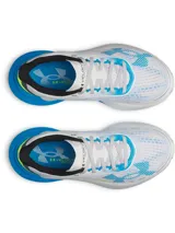 Championes de running Under Armour W Velociti Distance, color blanco con detalles en azul y amarillo flúor. Cuenta con capellada de malla transpirable y entresuela con tecnología UA HOVR+ para mayor amortiguación.