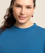 Blusa tipo muscle tee de Ashua, confeccionada en tejido ribana con textura acanalada, cuello redondo y diseño sin mangas.