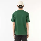 Remera lisa de corte oversize y cuello redondo, de manga corta y diseño holgado en color verde.