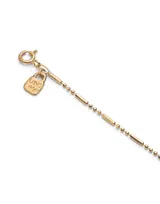 Cadena dorada fina con eslabones tipo barra y bolitas, bañada en oro 18k.