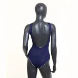 Malla enteriza de natación Fila Double Ii Listrado, con diseño color block en rosa y azul marino. Logo de la marca estampado en el lateral.