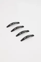 Pack de cuatro pinzas para el pelo color negro con diseño calado.
