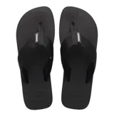Sandalias tipo ojota Havaianas modelo Urban Basic, color negro, con tiras de tela y suela de goma texturizada.