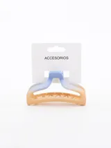 Pinza para el pelo con forma de mandíbula, color celeste en la parte superior y naranja en la parte inferior, con dientes internos para sujetar el cabello.