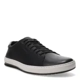Zapatos casuales de hombre, estilo sneaker de caña baja, color negro con capellada de cuero liso. Posee cordones negros y una suela gruesa de goma blanca con una línea negra fina en la base. El cuello del zapato tiene un detalle de tela texturizada gris.