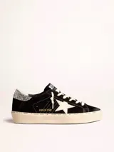 Zapatillas Golden Goose modelo Hi Star, color negro con estrella blanca y detalles plateados con glitter.