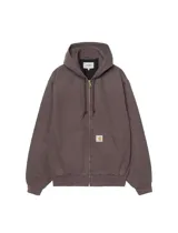 Campera con capucha Carhartt WIP modelo OG Active Jacket, de lona color marrón oscuro con lavado efecto desgastado, cierre frontal completo y bolsillos estilo canguro. Cuenta con parche con logo de la marca en el bolsillo inferior y puños y ruedo de rib elástico.