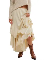 Falda maxi color crema con diseño floral jacquard, bajo asimétrico con volantes y detalle de lazo en el costado.