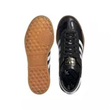 Championes adidas modelo Hamburg, de diseño clásico con exterior de cuero negro, las icónicas tres tiras laterales en blanco y suela de goma color caramelo. Incluye el nombre del modelo en letras doradas en el lateral.