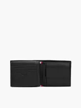 Billetera plegable de cuero Tommy Hilfiger en color negro, con acabado granulado y logo esmaltado de la marca en la esquina inferior.
