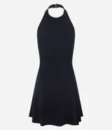 Vestido corto negro de malla punto roma, con escote halter y espalda descubierta. El ruedo es levemente evasé.
