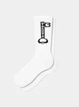 Medias blancas de caña alta con diseño gráfico en negro de una llave estilo pixel art.