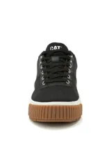 Sneakers Caterpillar modelo Amp Canvas, de color negro con suela de plataforma blanca y base de goma marrón. Capellada de lona con detalles de poliuretano, cordones negros y ojalillos metálicos. Presenta la inscripción de la marca en la lengüeta y en el lateral del talón.
