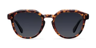 Lentes de sol redondos con montura carey y lentes negros polarizados. Fabricados con materiales bio-based G850 y patillas de propionato de celulosa. Protección UV400.