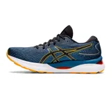 Championes de running Asics Gel-Nimbus 24, de color azul oscuro con detalles en amarillo y suela blanca y naranja. Cuentan con tecnología FF Blast+ y amortiguación de gel para mayor comodidad.