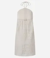 Vestido corto con lazo en el cuello y textura floral.