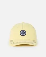 Gorro cap Rip Curl modelo Sg Washed, de color amarillo suave con efecto deslavado. Cuenta con visera curva con costuras pespunteadas y un parche circular bordado en el frente.