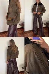 Chaqueta bomber de cuero ovino color marrón con cuello de piel sintética negro desmontable.