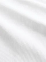 Remera de manga larga con cuello redondo, confeccionada en tejido acanalado de ajuste entallado.