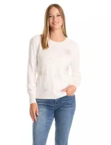 Buzo de punto liviano color blanco, con cuello redondo y mangas largas con frunce en la copa. Presenta apliques de strass en forma de destellos distribuidos en el frente. Cuenta con puños y cintura en tejido acanalado.