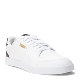 Championes urbanos Puma modelo Shuffle, color negro con detalles en blanco. Presentan una silueta de corte bajo, confeccionados en cuero sintético con perforaciones en la puntera y plantilla SoftFoam+ para mayor amortiguación.