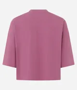 Remera de corte cropped confeccionada en algodón, con cuello redondo y mangas cortas. Presenta un diseño básico y versátil de calce holgado.